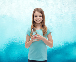 Image showing smiling little girl with glass of water