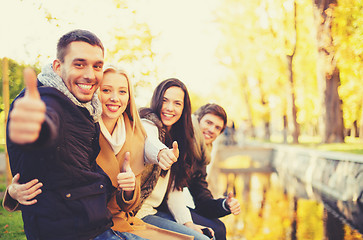 Image showing group of friends having fun in autumn park