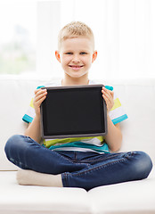 Image showing smiling boy with tablet pc computer at home