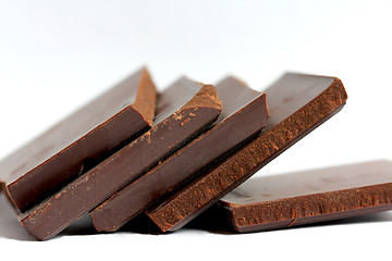 Image showing Close up of Cut Chocolate Pieces on White Background