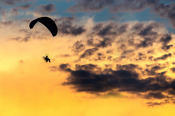 Image showing unidentified skydiver, parachutist on blue sky