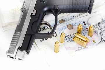 Image showing gun with bullet on czech banknotes