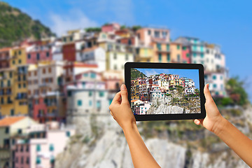 Image showing Manorola Woman taking pictures on a tablet