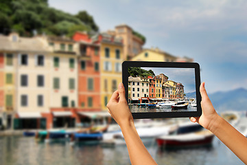 Image showing Portofino Woman taking pictures on a tablet