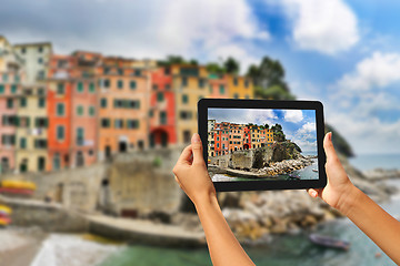 Image showing Riomaggiore Woman taking pictures on a tablet