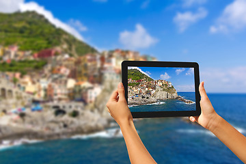 Image showing Girl taking pictures on a tablet in Manorola