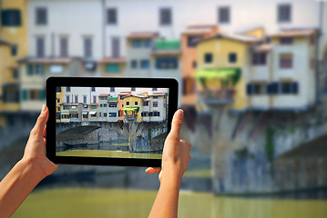 Image showing Ponte Vecchio Woman taking pictures on a tablet