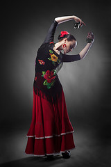 Image showing woman dancing flamenco with castanets