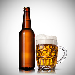 Image showing Beer in glass and bottle on white