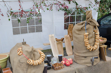 Image showing mead barrel under bags decorated crispy string  