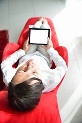 Image showing young woman watching tv at home