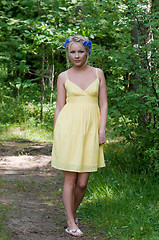 Image showing Young beautiful lady in yellow dress in