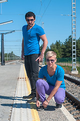 Image showing Handsome guys on train station