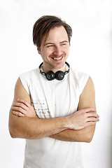 Image showing Attractive smiling man with headphones 