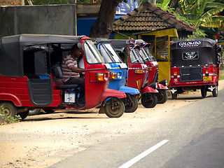 Image showing Taxi stand at the roadside