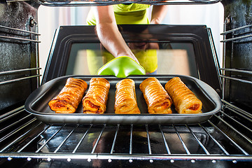 Image showing Cooking in the oven at home.