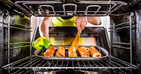 Image showing Cooking in the oven at home.