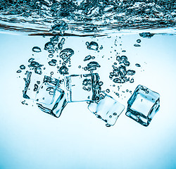 Image showing Ice cubes falling under water