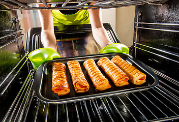 Image showing Cooking in the oven at home.