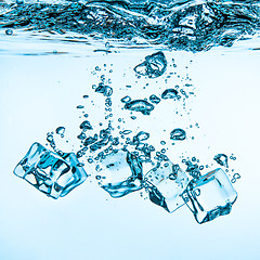 Image showing Ice cubes falling under water