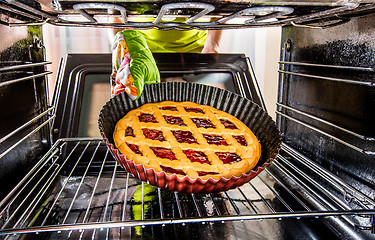 Image showing Cooking in the oven at home.