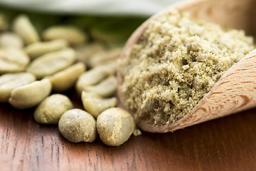 Image showing Green coffee beans with leaf