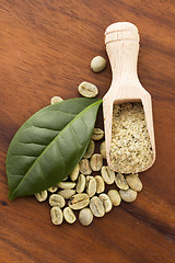 Image showing Green coffee beans with leaf