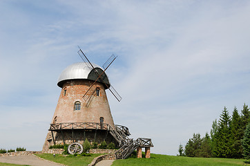 Image showing big old brick mill with stairs on the summer time 