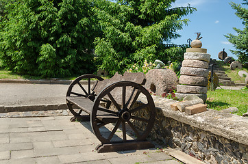 Image showing bench wheel carriage rail stacked tower millstones 