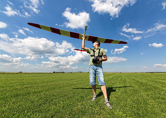 Image showing Man launches into the sky RC glider