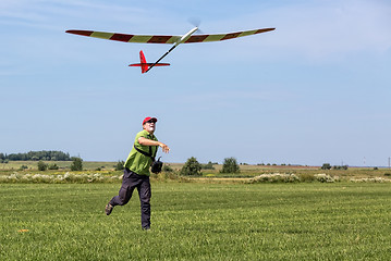 Image showing Man launches into the sky RC glider