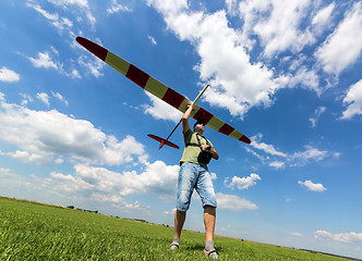 Image showing Man launches into the sky RC glider