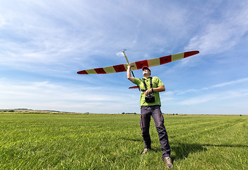 Image showing Man launches into the sky RC glider