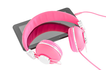 Image showing Vibrant pink female headphones and black tablet pc