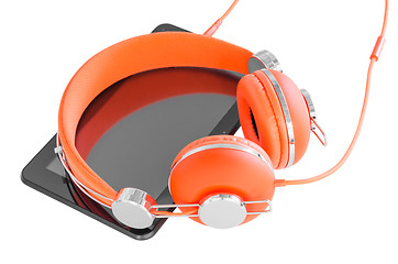 Image showing Vivid orange headphones and black tablet pc