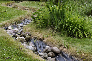 Image showing artificial pond stream and decorative landscaped garden