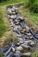 Image showing artificial pond stream and decorative landscaped garden