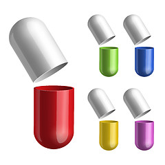 Image showing Set of pills opened in two halfs .