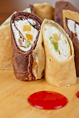 Image showing pancake roll with marmalade