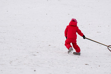 Image showing child with red waterproof overall outdoor winter 