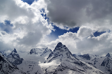 Image showing Evening mountains in sunlight clouds