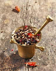 Image showing various spices in mortar and pestle