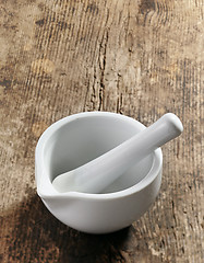 Image showing empty mortar and pestle on wooden table