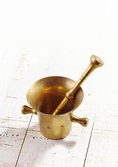 Image showing mortar and pestle on white wooden table