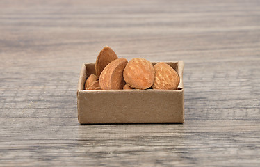 Image showing Almonds on wood