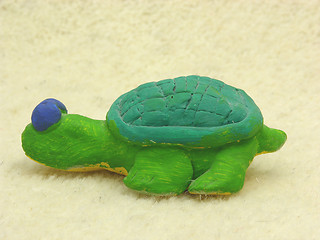 Image showing Hand made ceramic turtle on soft background