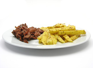 Image showing Soy Geschnetzeltes and french fries on white plate