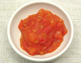 Image showing Tomato dip in an little bowl of chinaware on beige