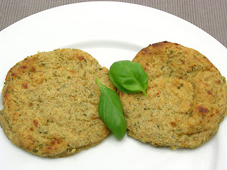 Image showing Round flat potato dough cakes with basil 