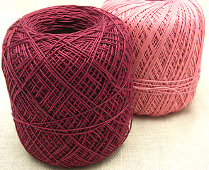 Image showing Two balls of wool  on a beige background